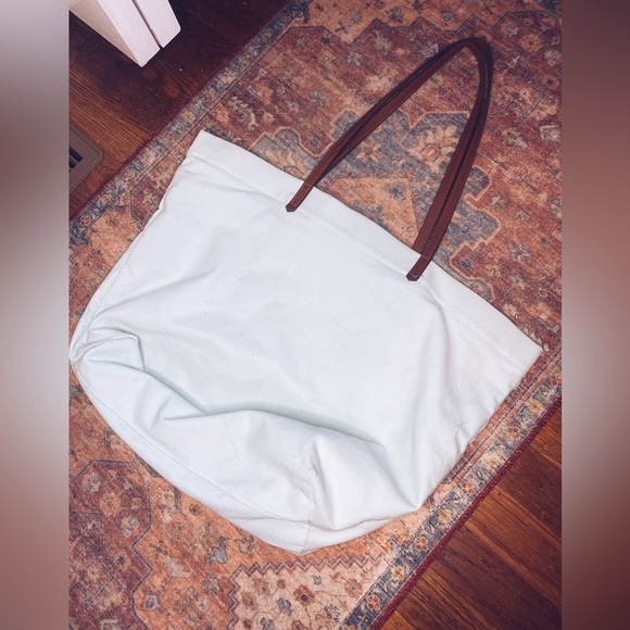 “Choose Happy” Tote, Canvas Fabric light blue color with leather handles. - Picture 2 of 3